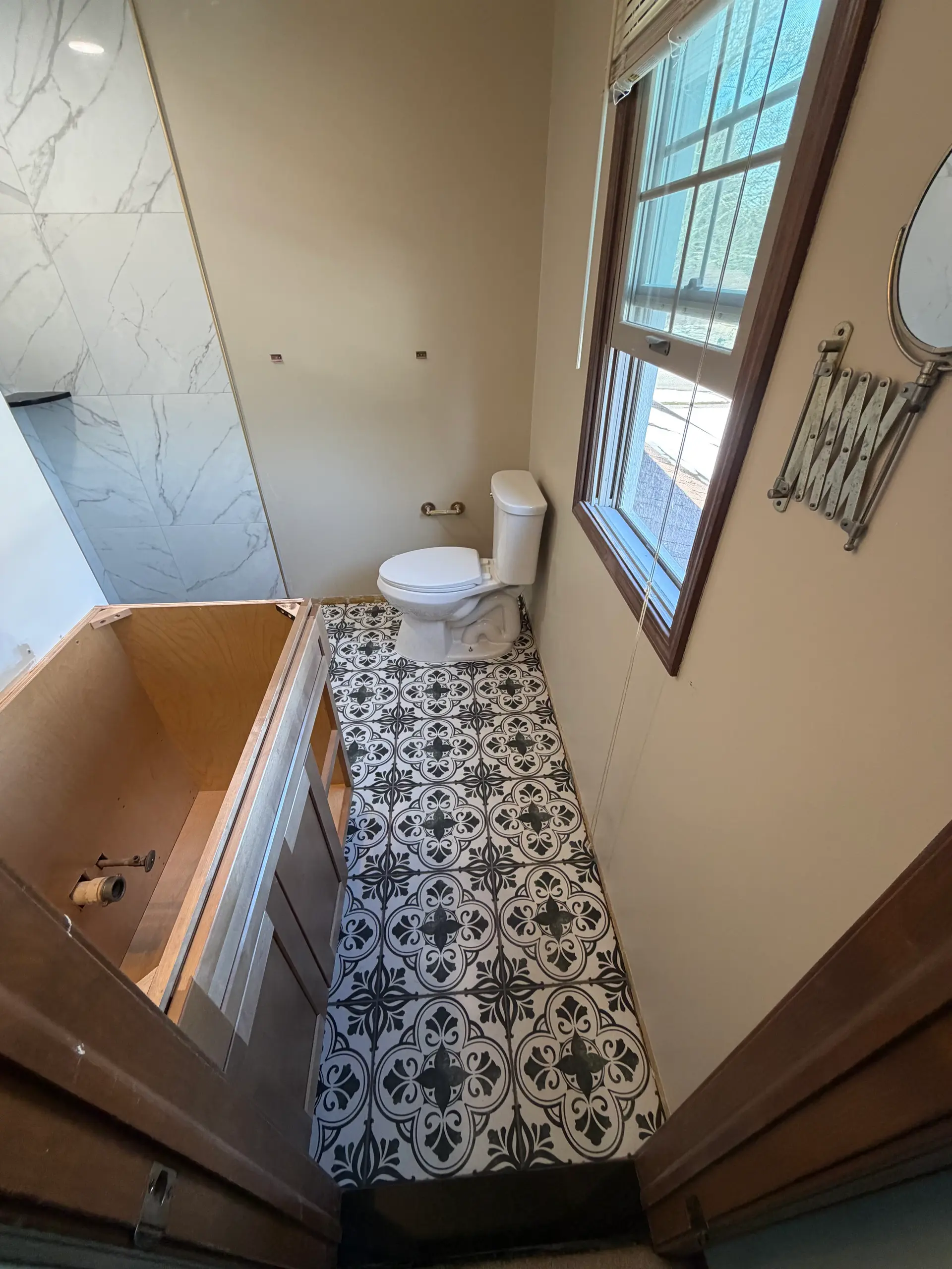 Residential shower remodel with built-in shelf and bench