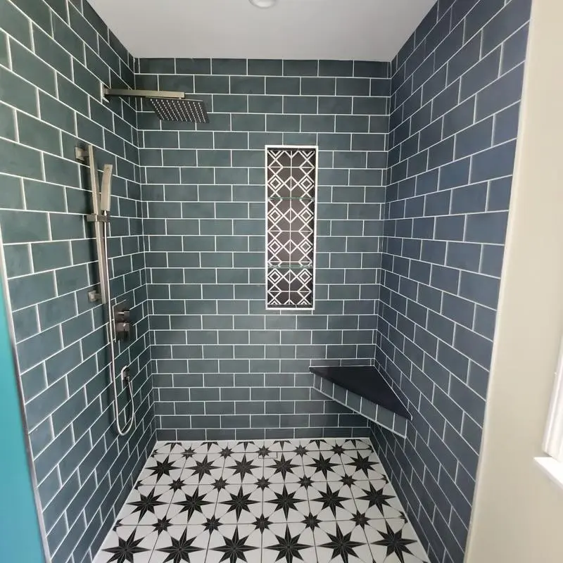 Residential bathroom remodel with large-format floor tiles