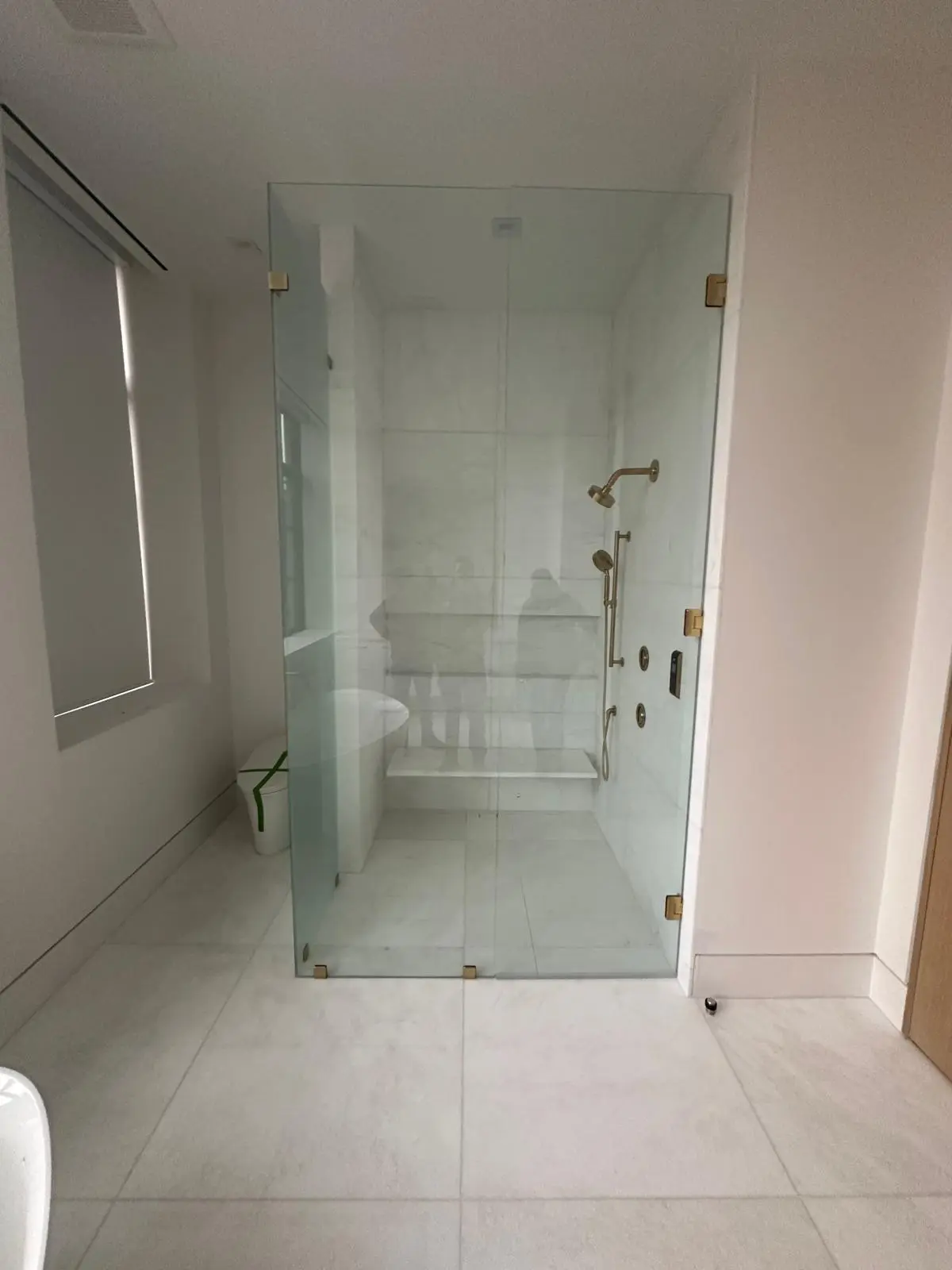 Master bathroom renovation with porcelain wall and floor tile