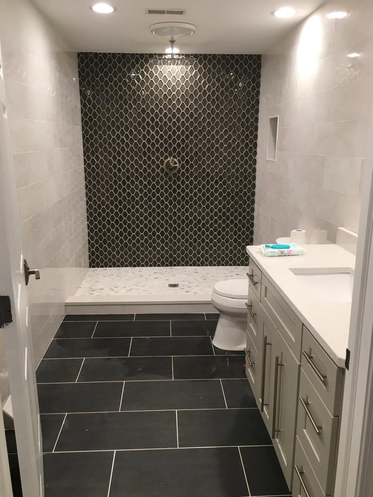 Full bathroom renovation — tile walls and mosaic floor